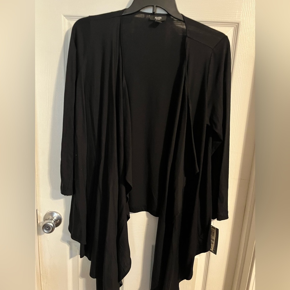 Ladies light weight jacket or wrap. Can be worn open or over the shoulder.